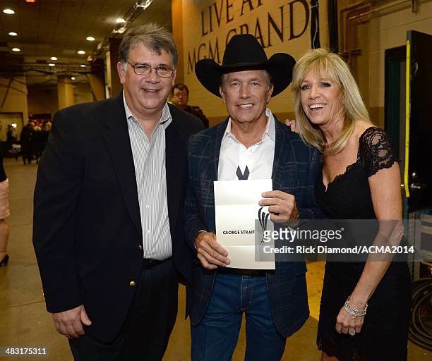 Academy of Country Music CEO Bob Romeo, singer George Strait and Norma Strait attend the 49th Annual Academy of Country Music Awards at the MGM Grand...