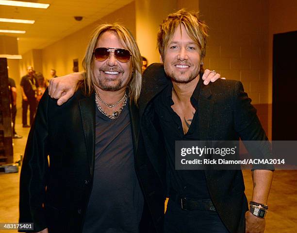 Singers Vince Neil and Keith Urban attend the 49th Annual Academy of Country Music Awards at the MGM Grand Garden Arena on April 6, 2014 in Las...