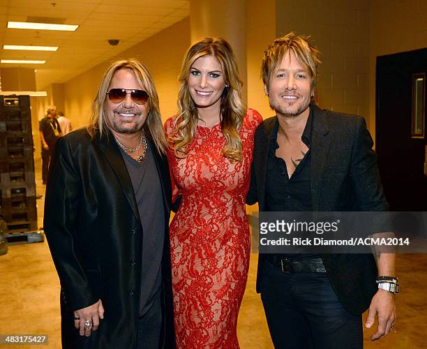 Recording artist Vince Neil, Rain Andreani and recording artist Keith Urban attend the 49th Annual Academy of Country Music Awards at the MGM Grand...