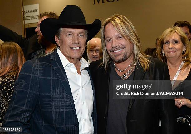 Singers George Strait Singer and Vince Neil attend the 49th Annual Academy of Country Music Awards at the MGM Grand Garden Arena on April 6, 2014 in...