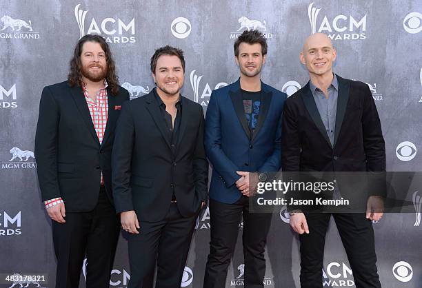 Musicians James Young, Mike Eli, Chris Thompson and Jon Jones of the Eli Young Band attends the 49th Annual Academy Of Country Music Awards at the...