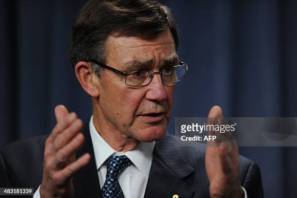 Angus Houston, head of the Joint Agency Coordination Centre leading the search for missing Malaysia Airlines flight MH370, speaks during a media...