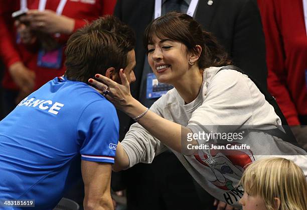 French singer Nolwenn Leroy congratulates her longtime boyfriend french Davis Cup captain Arnaud Clement after the victorious second round Davis Cup...