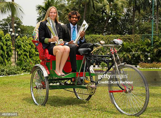 Meg Lanning, captain of Australia and Lasith Malinga, captain of Sri Lanka poses with the trophies on a rickshaw during a photocall after winning the...