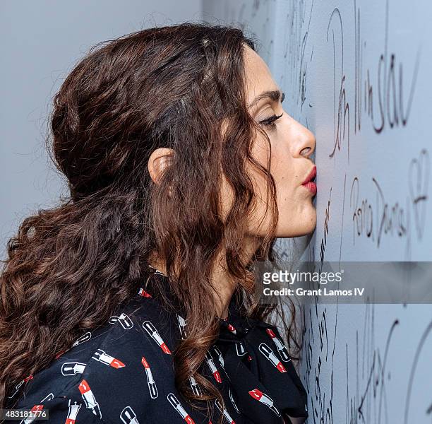 Salma Hayek kisses the autograph wall at AOL BUILD Speaker Series: "Kahlil Gibran's The Prophet" at AOL Studios In New York on August 6, 2015 in New...