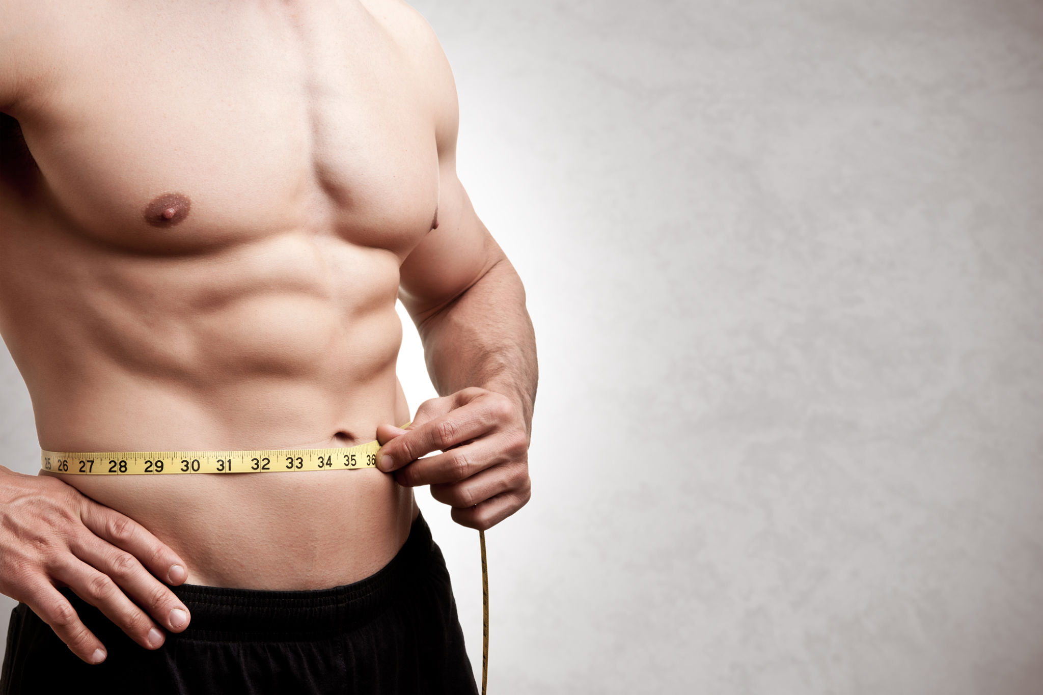 Fit Man Measuring His Waist Fit Man Measuring His Waist