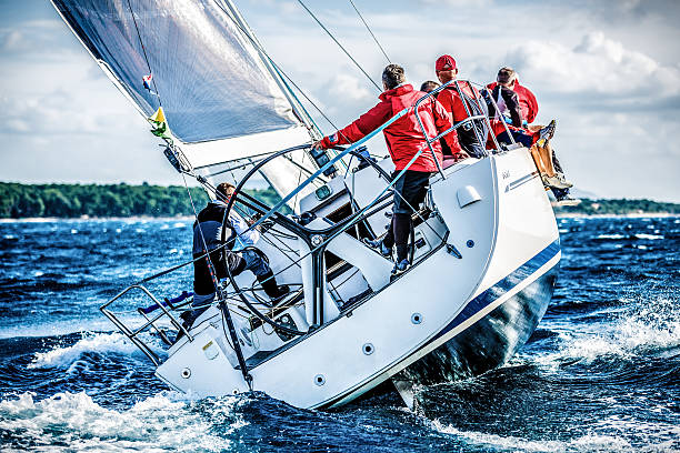 sailing crew on sailboat during regatta - sailboat racing stock pictures, royalty-free photos & images