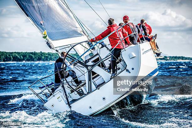 sailing crew on sailboat during regatta - crew stock pictures, royalty-free photos & images