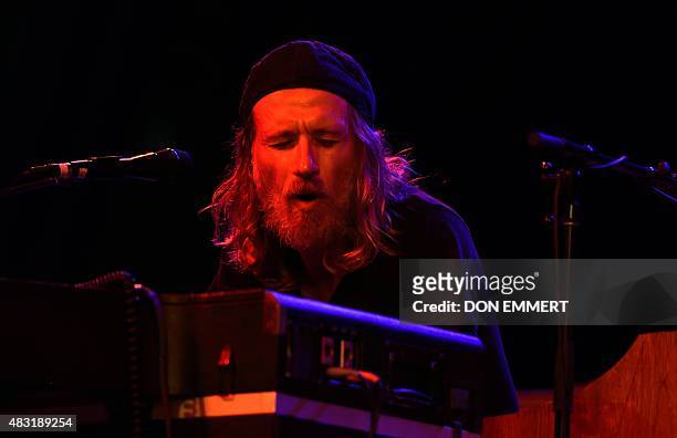 The band Dawes keyboard player Tay Strathairn performs July 27, 2015 in New York's Central Park. Fifty years after Bob Dylan went electric, Dawes...