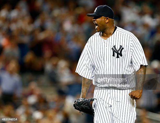 Pitcher CC Sabathia of the New York Yankees reacts after striking out David Ortiz of the Boston Red Sox to end the fifth inning during a MLB baseball...