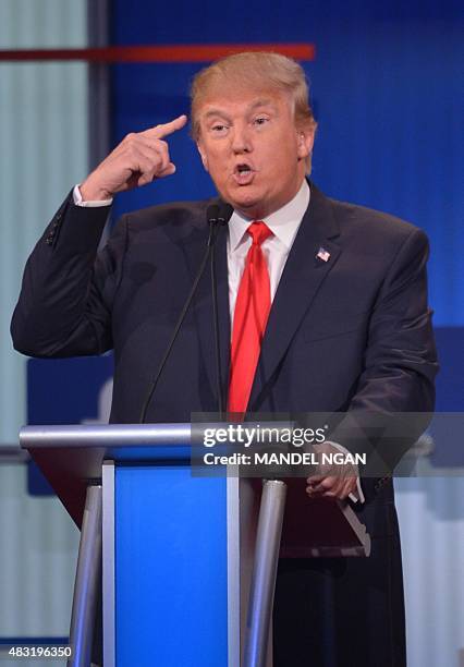 Real estate tycoon Donald Trump participates in the Republican presidential primary debate on August 6, 2015 at the Quicken Loans Arena in Cleveland,...