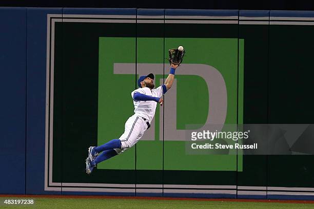 Toronto Blue Jays center fielder Kevin Pillar makes a leaping catch on Miguel Sano in to record the last out of the top of the eighth inning as the...