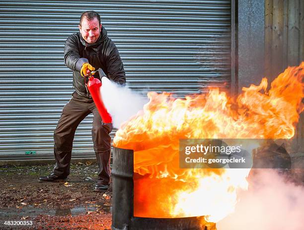 fighting fire - extinguishing stockfoto's en -beelden