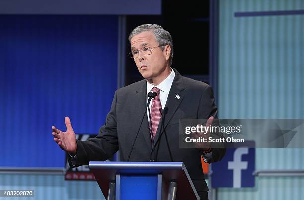 Republican presidential candidate Jeb Bush fields a question during the first Republican presidential debate hosted by Fox News and Facebook at the...