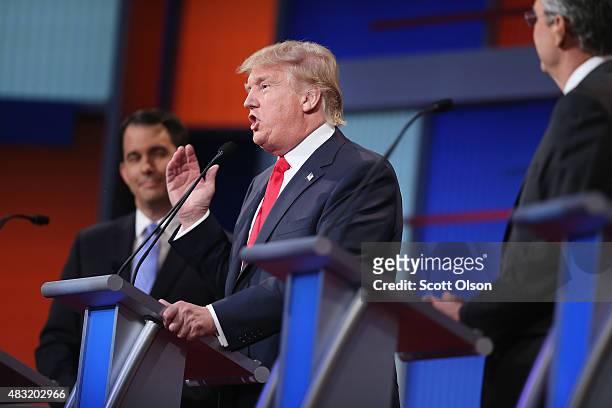 Republican presidential candidate Donald Trump fields a question during the first Republican presidential debate hosted by Fox News and Facebook at...