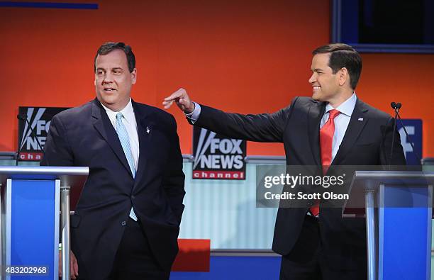 Republican presidential candidate New Jersey Gov. Chris Christie and Sen. Marco Rubio chat during a break in the first Republican presidential debate...