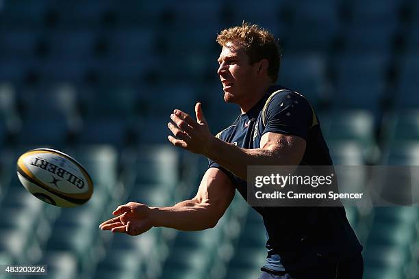 David Pocock of the Wallabies passes during the Australian Wallabies captain's run at ANZ Stadium on August 7, 2015 in Sydney, Australia.