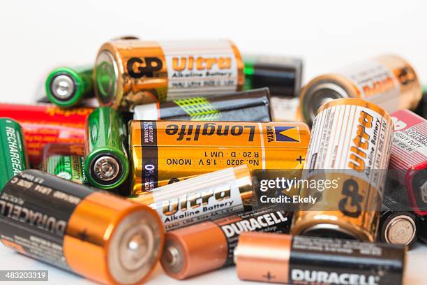 collection of different battery brands - alkaline stock pictures, royalty-free photos & images