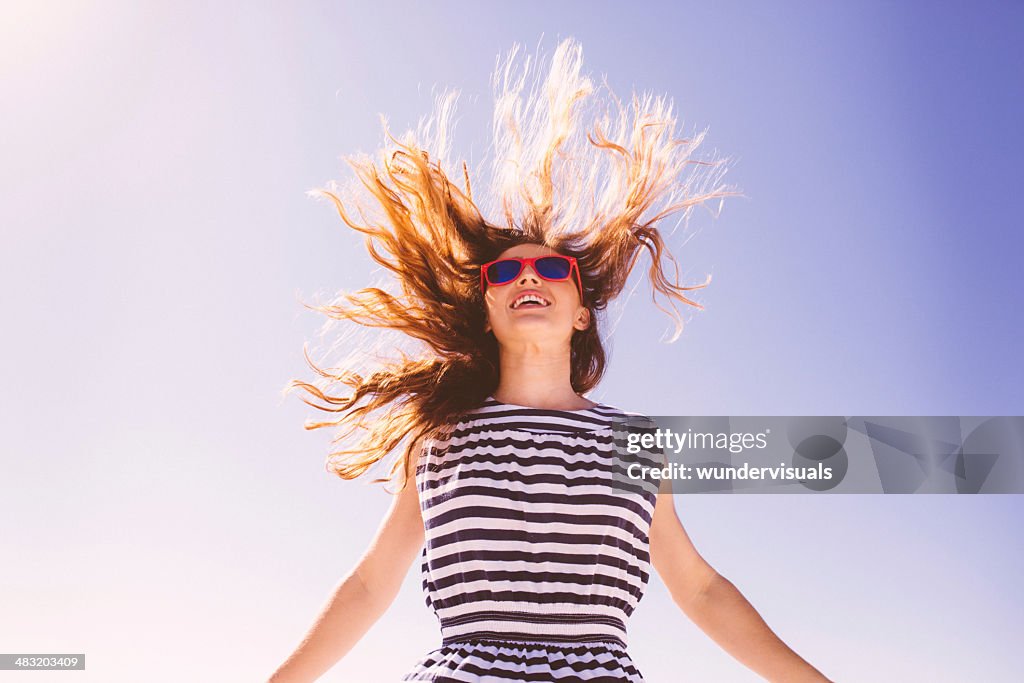 Jumping girl with flying hair
