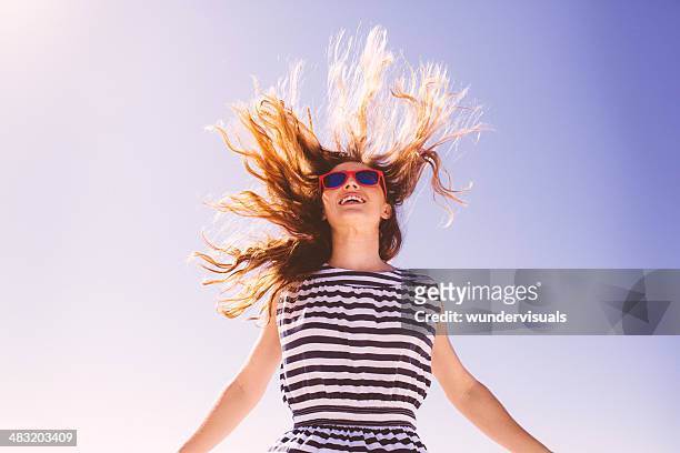 jumping girl with flying hair - jumping sun bildbanksfoton och bilder