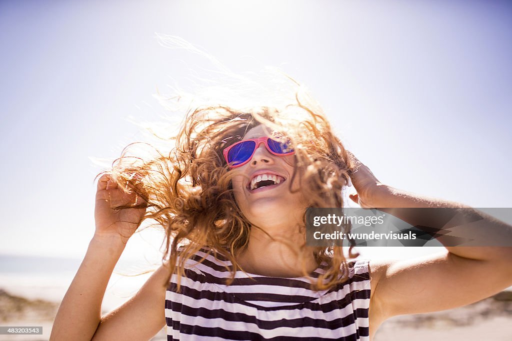 Cheerful laughing woman on the beach