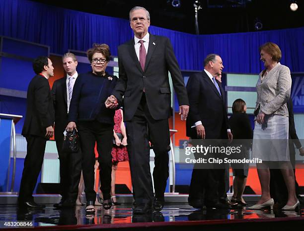 Republican presidential candidate Jeb Bush and his wife Columba Bush leave the stage after the first prime-time presidential debate hosted by FOX...