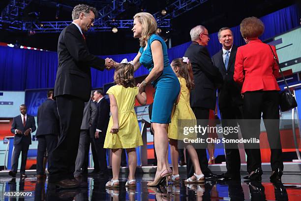 Republican presidential candidate Sen. Rand Paul greets Heidi Nelson Cruz, wife of Sen. Ted Cruz , and their children as John Kasich visits after the...
