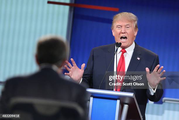 Republican presidential candidate Donald Trump fields a question during the first Republican presidential debate hosted by Fox News and Facebook at...