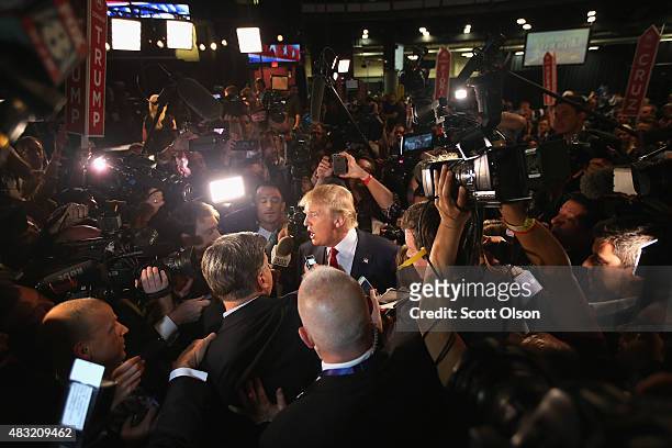 Republican presidential candidate Donald Trump talks to reporters in the 'Spin Alley' after the first prime-time presidential debate hosted by FOX...