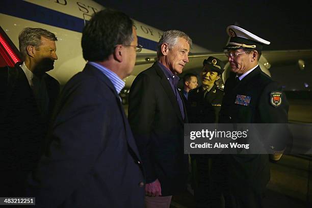 Secretary of Defense Chuck Hagel is welcomed by Sun Jianguo , Deputy Chief of General Staff of the Chinese People's Liberation Army, as U.S....