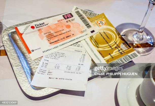 Picture taken in Lille, northern France on April 7, 2014 shows traditional meal vouchers called "Tickets restaurant", used by employees to pay the...