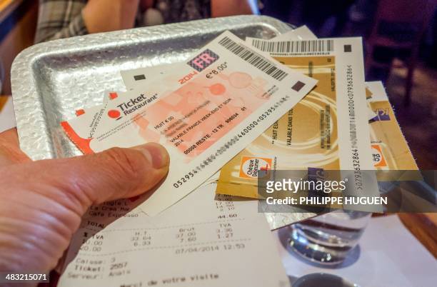 Picture taken in Lille, northern France on April 7, 2014 shows traditional meal vouchers called "Tickets restaurant", used by employees to pay the...