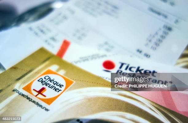 Picture taken in Lille, northern France on April 7, 2014 shows traditional meal vouchers called "Tickets restaurant", used by employees to pay the...