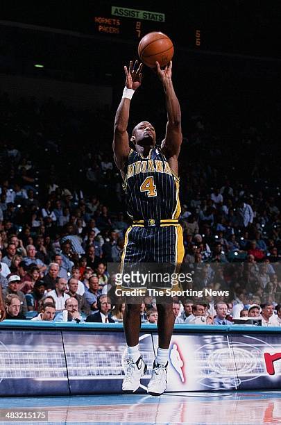 Travis Best of the Indiana Pacers shoots during the game against the Charlotte Hornets on April 9, 2000 at Charlotte Colesium in Charlotte, North...