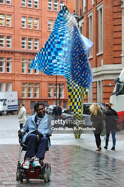 Artist Yinka Shonibare MBE poses as he unveils the new 'Wind Sculpture' on Howick Place on April 7, 2014 in London, England.