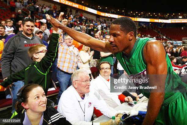 Othyus Jeffers of the Iowa Energy celebrates by high-fiving a fan after defeating the Los Angeles D-Fenders in an NBA D-League game on April 5, 2014...