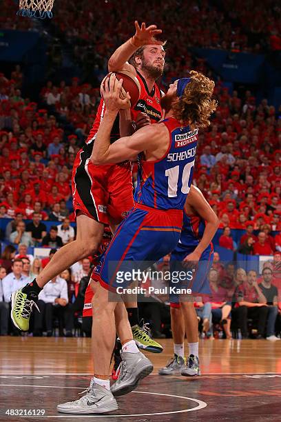 Jesse Wagstaff of the Wildcats fouls Luke Schenscher of the 36ers during game one of the NBL Grand Final series between the Perth Wildcats and the...
