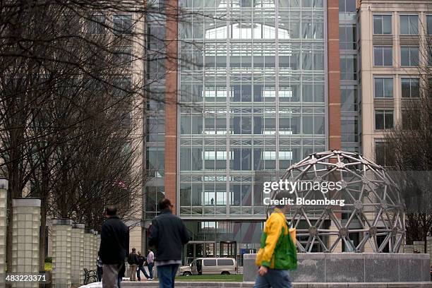 Pedestrians walk near the U.S. Patent and Trademark Office headquarters in Alexandria, Virginia, U.S., on Friday, April 4, 2014. The Senate Judiciary...