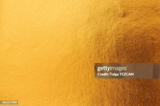 gold hintergrund - goldfarbig stock-fotos und bilder