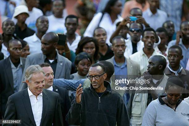 Former British Prime Minister Tony Blair and Rwandan President Paul Kagame lead the Walk to Remember into Amahoro Stadium during the 20th anniversary...