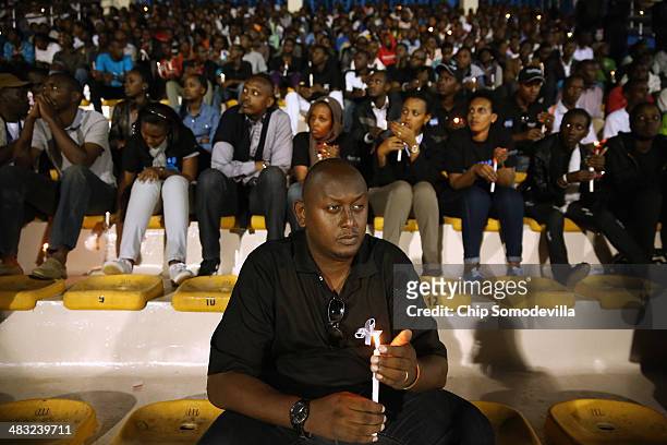 Rwandans hold a candle light vigil at Amahoro Stadium during the 20th anniversary commemoration of the 1994 genocide April 7, 2014 in Kigali, Rwanda....