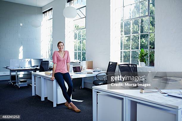 businesswoman in trendy office - leaning stock pictures, royalty-free photos & images