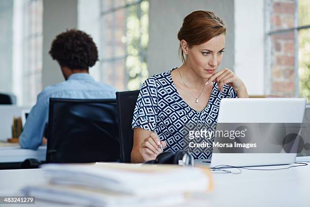 woman studying business strategy - concentration stock pictures, royalty-free photos & images
