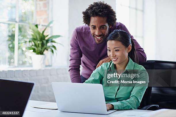 work colleagues reviewing tasks - big hair stock pictures, royalty-free photos & images