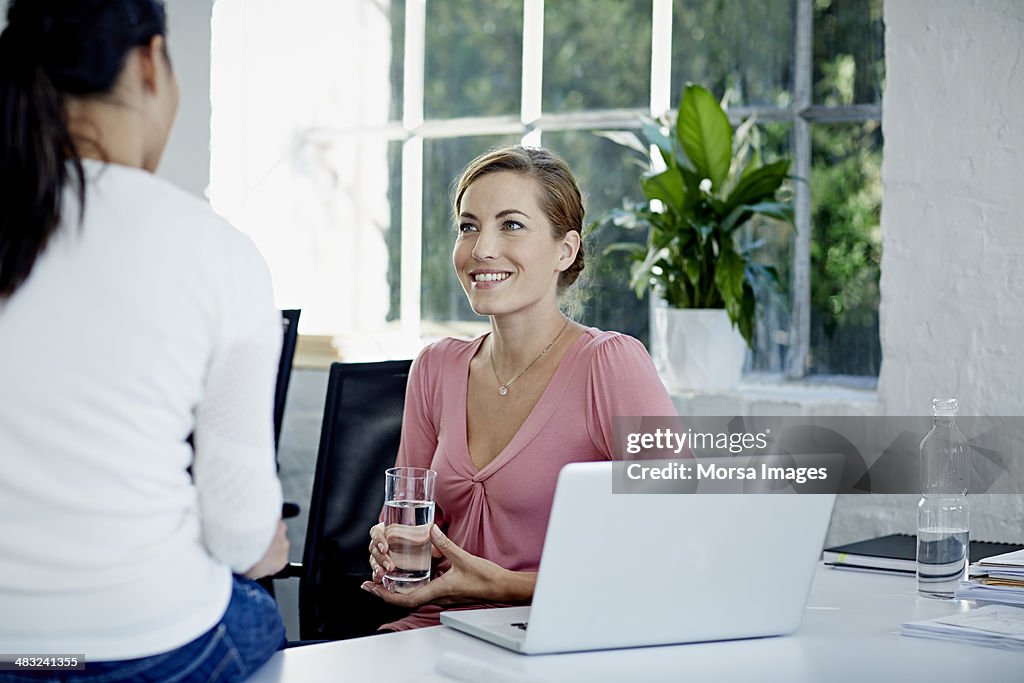 Work colleagues chatting