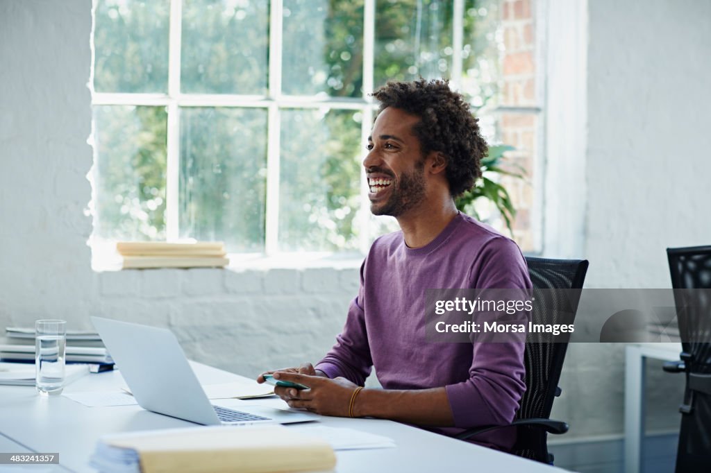 Businessman texting on the phone