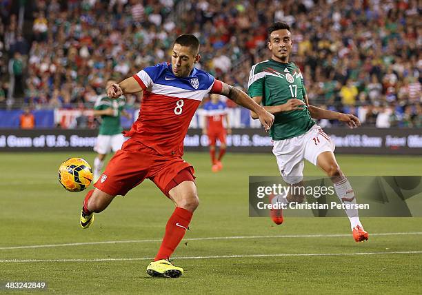 Clint Dempsey of USA shoots the ball past Jesus Eduardo Zavala of Mexico during the first half of the International Friendly at University of Phoenix...