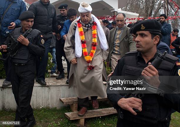 Farooq Abdullah, a minister in the Indian government and patron of the pro-India National Conference party and a contesting candidate is escorted by...