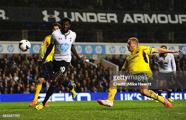 Emmanuel Adebayor of Tottenham Hotspur scores his team's first goal during the Barclays Premier League match between Tottenham Hotspur and Sunderland...