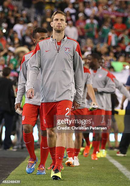 Clarence Goodson of USA leads teammates onto the field before the International Friendly against Mexico at University of Phoenix Stadium on April 2,...